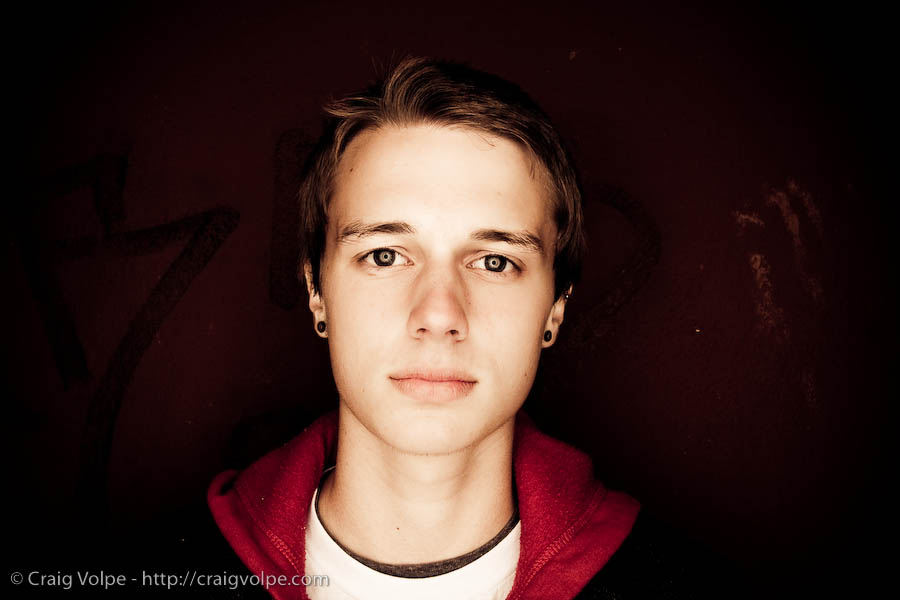 cav081009_8381 portrait in front of red graffiti wall