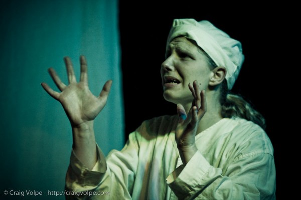 cav090109_0170 Scrooge (Gabrielle Hommes) begs on his knees as he's confronted by Death